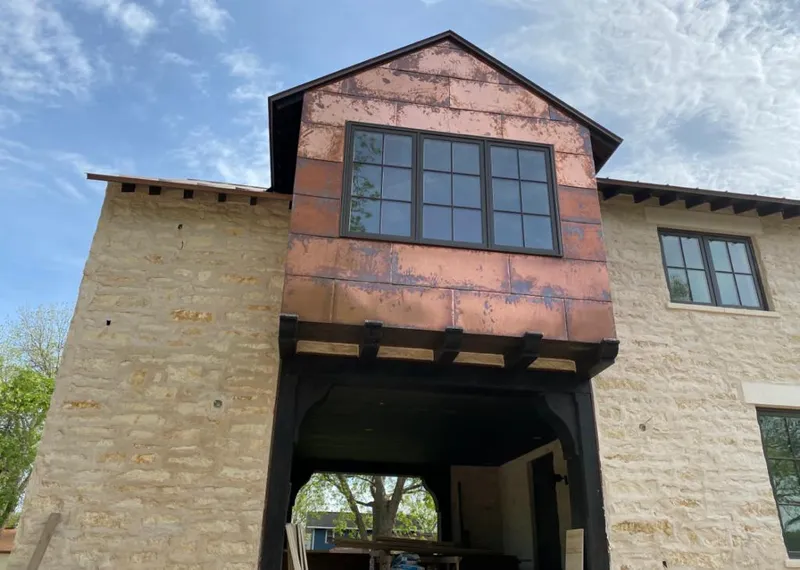 Copper metal panel facade on a stone building for Skylight Installation in Hopewell